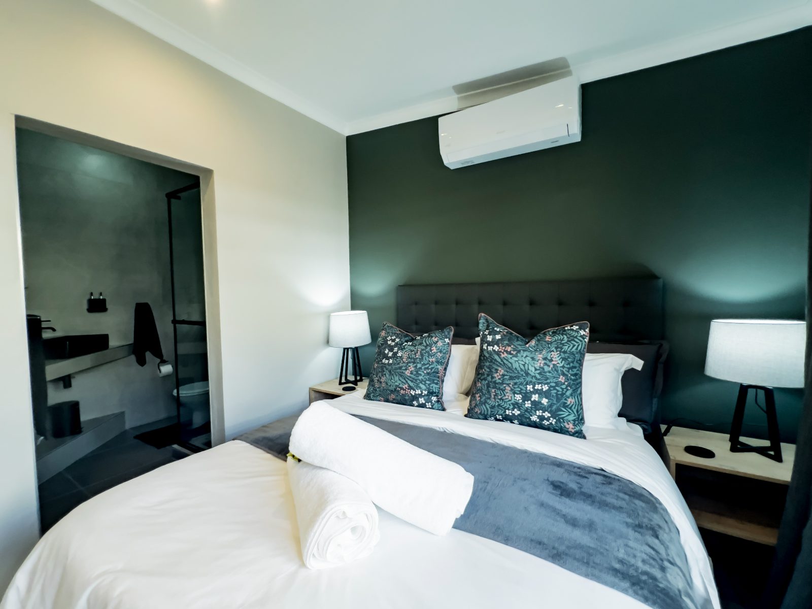 Queen-size bed with the en-suite off the bedroom